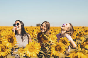 Three friends enjoying the sun with the safety of Nöz Sunscreen